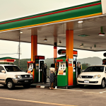 **

> A dramatic visual depicting the energy crisis. Show soaring oil prices and long lines at gas stations. Include a Thai family looking concerned about the cost of fuel. Use a warm, desaturated color palette to convey a sense of hardship and scarcity.

**
